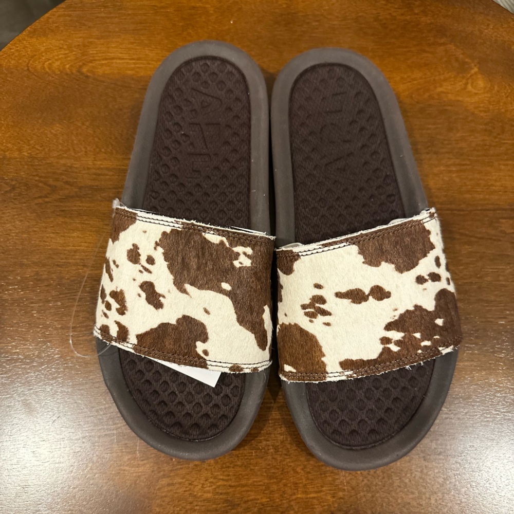 Women’s Athletic Propulsion Labs Iconic Slides Brown and White Cow Print